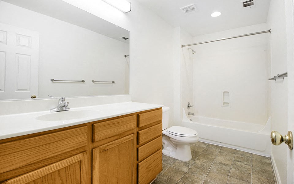 a bathroom with a sink toilet and a shower