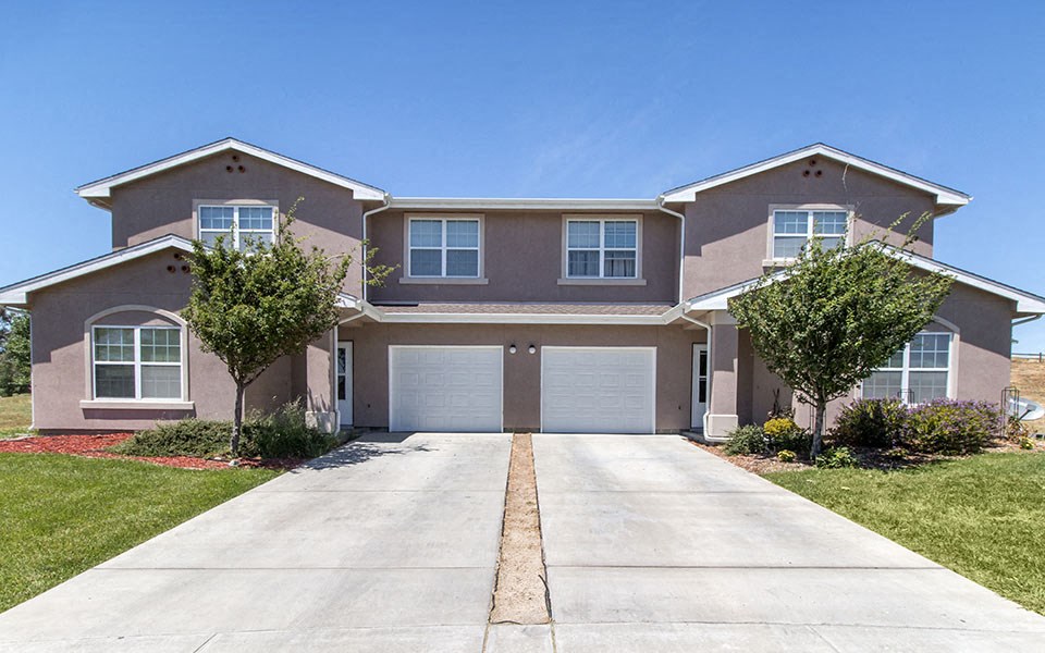 a house with a driveway and a garage door