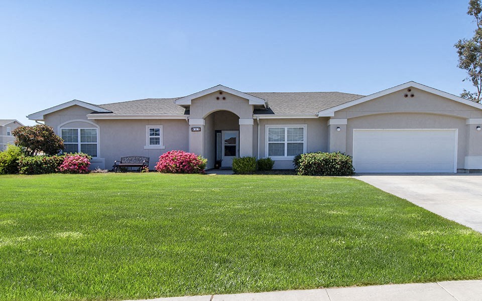 a house with a lawn in front of it