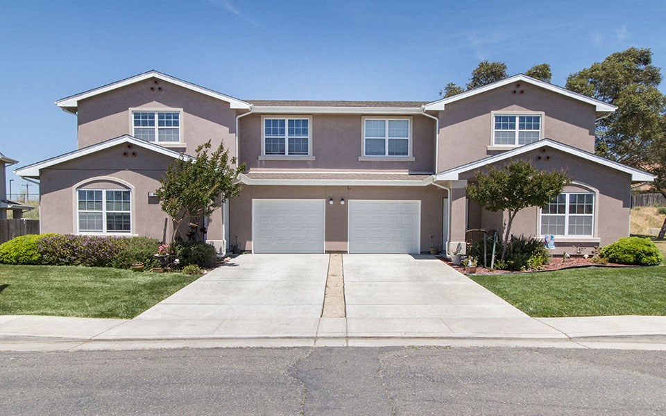 a house with a driveway and a garage door