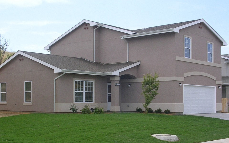 a house with a lawn in front of it