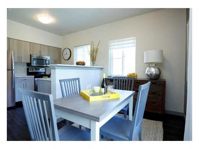 a kitchen with a table and chairs