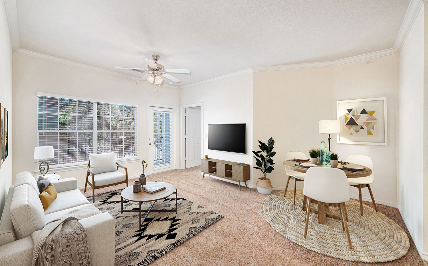 a living room with a couch and a table and a tv