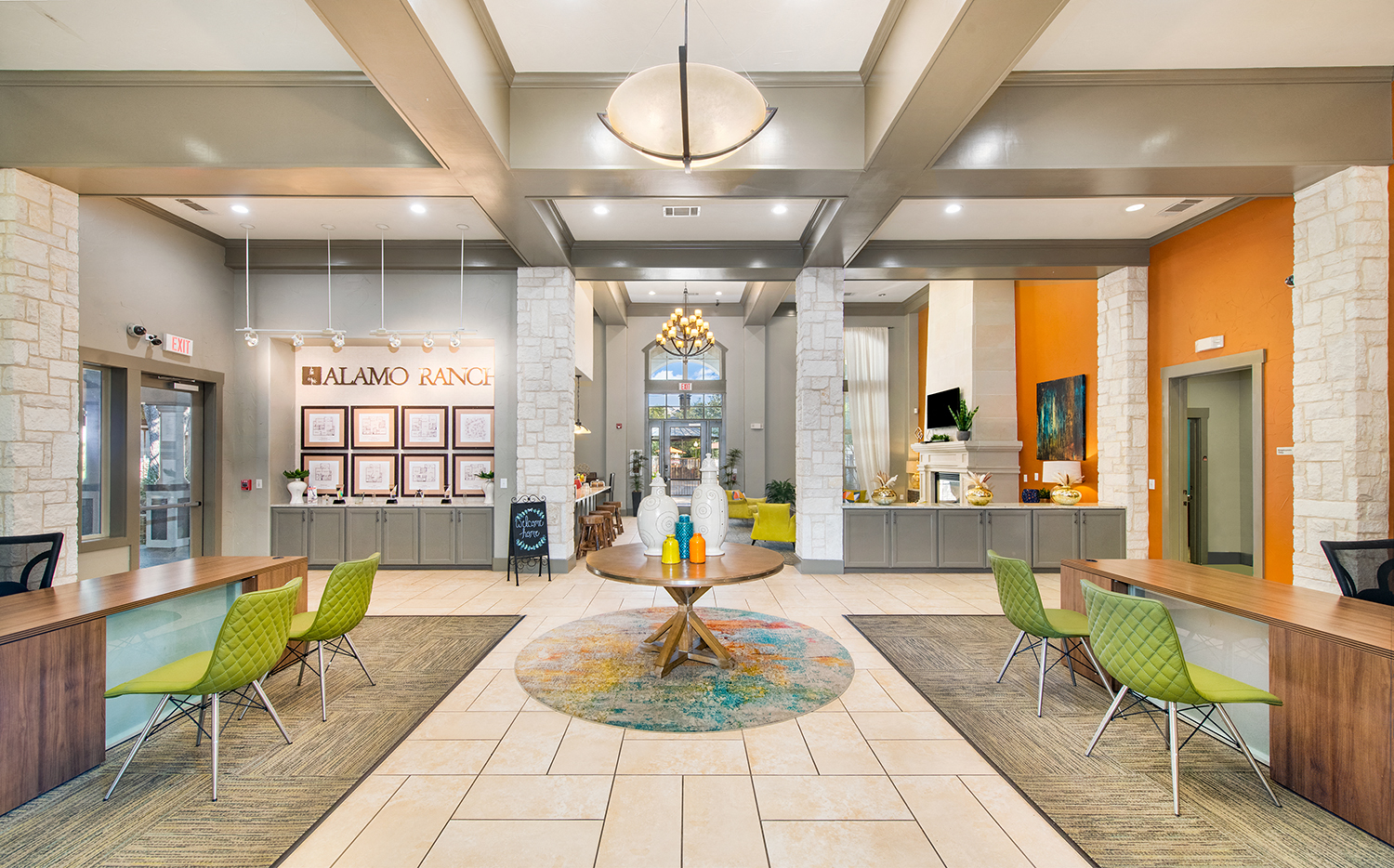 a lobby with tables and chairs and a reception desk