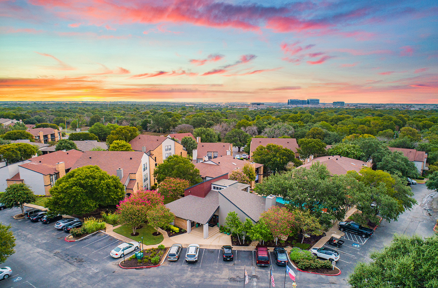 an aerial view of a neighborhood with houses and cars parked
