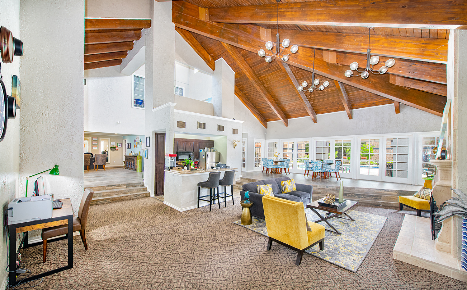 a large living room with a dining room and a kitchen