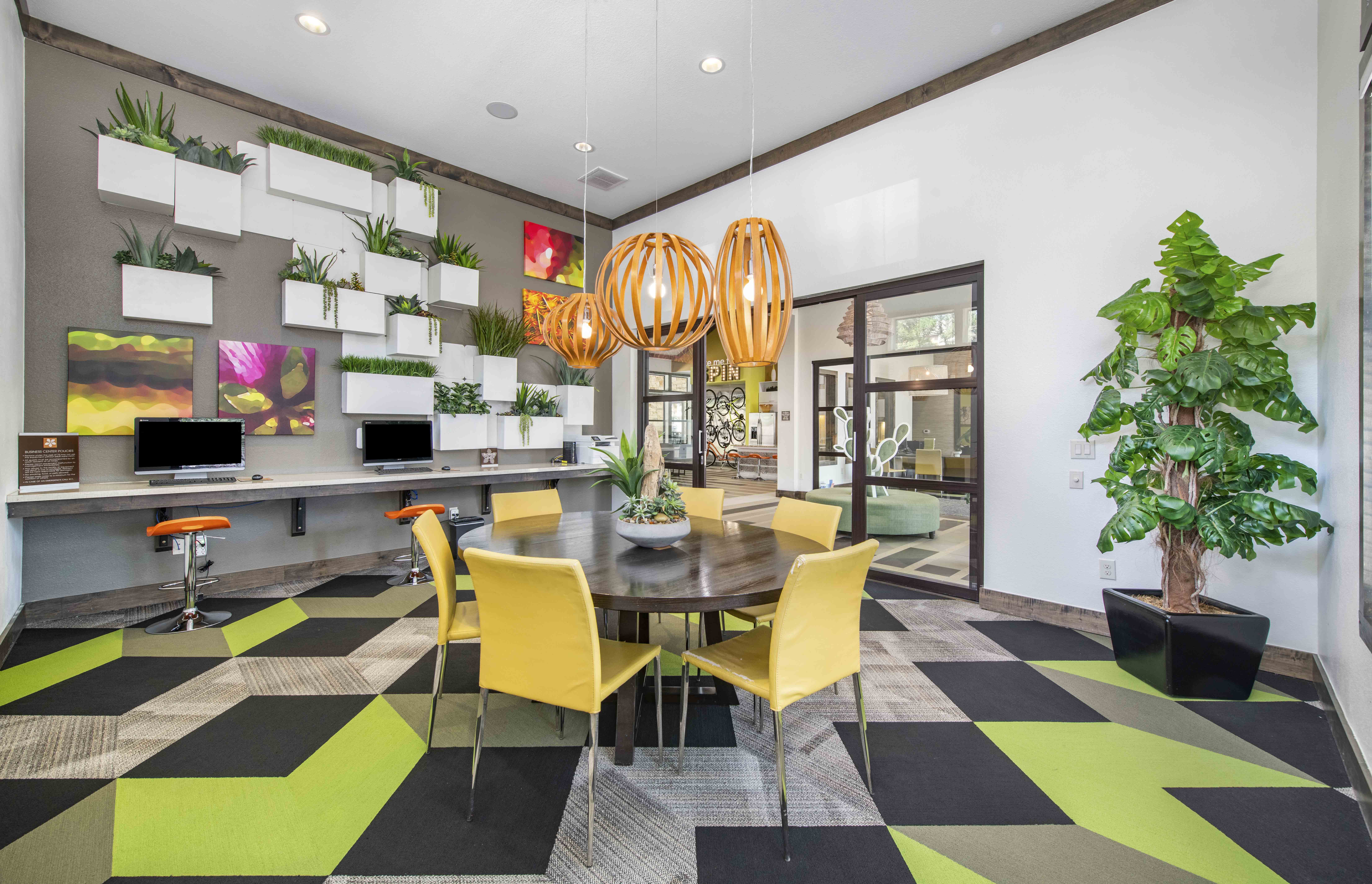 a dining room with yellow chairs and a table