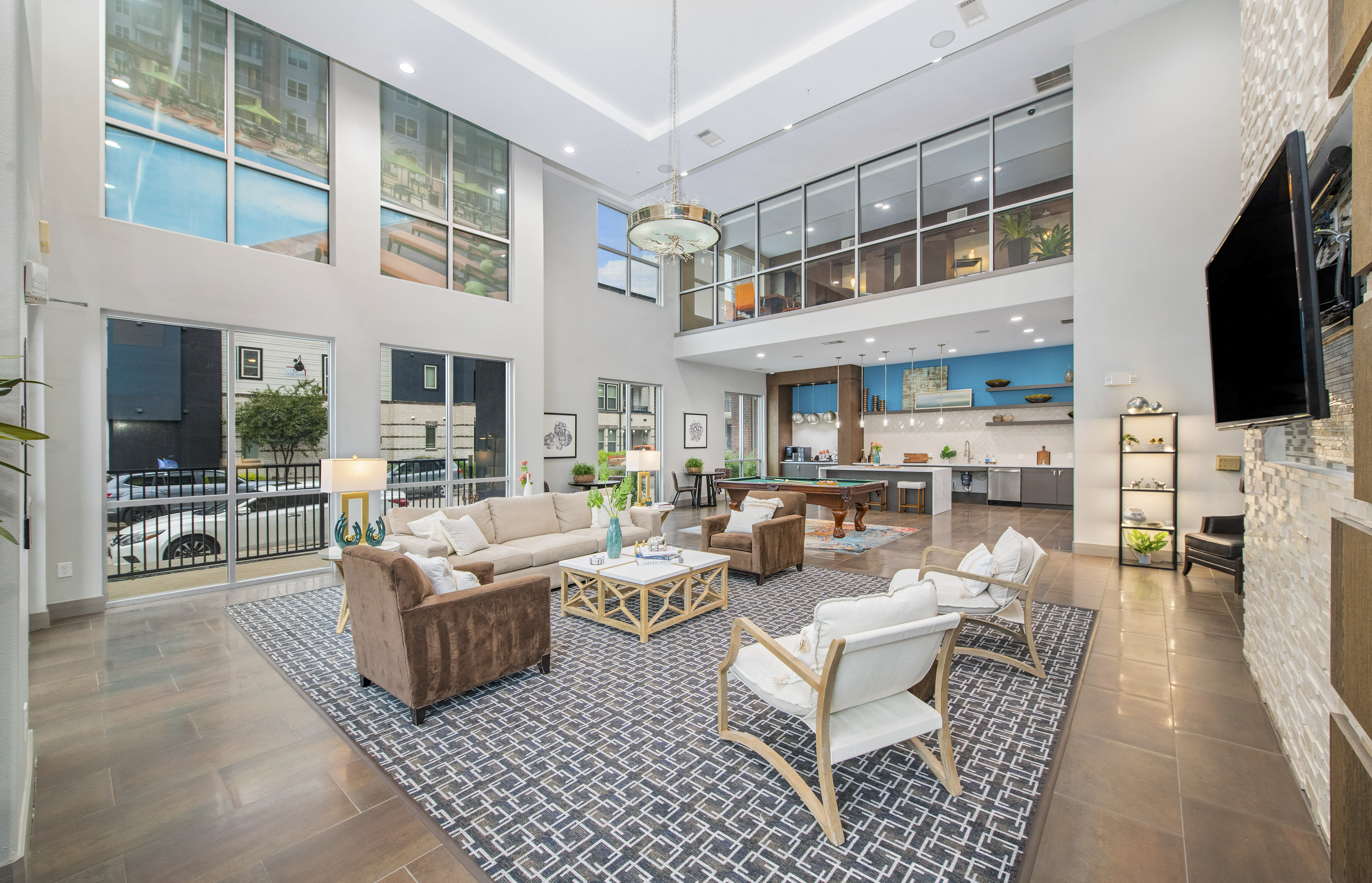 a living room with couches and chairs and a fireplace