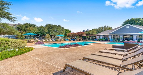 our resort style swimming pool is surrounded by our clubhouse and picnic tables