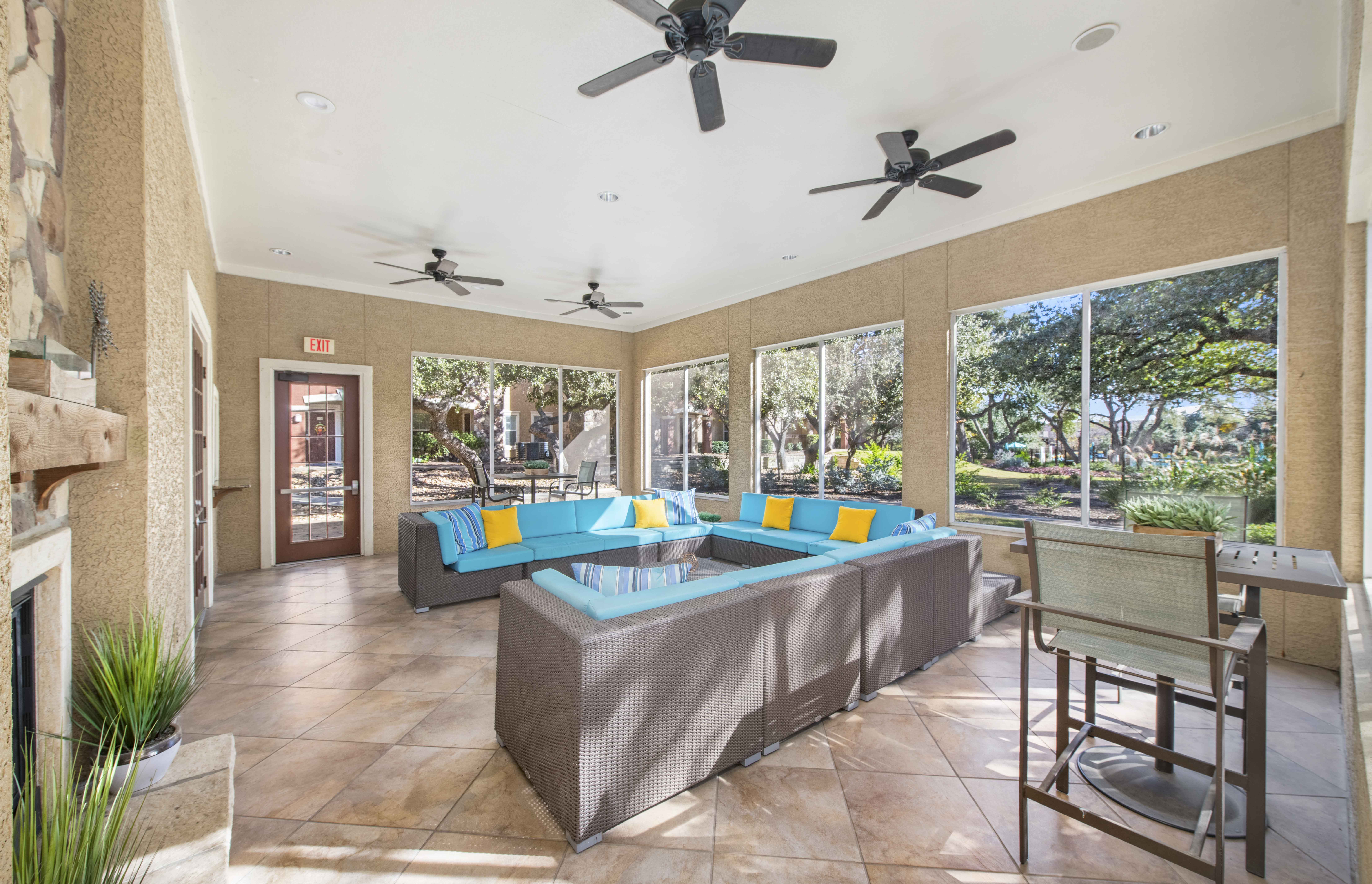 a living room with couches and a table with a pool
