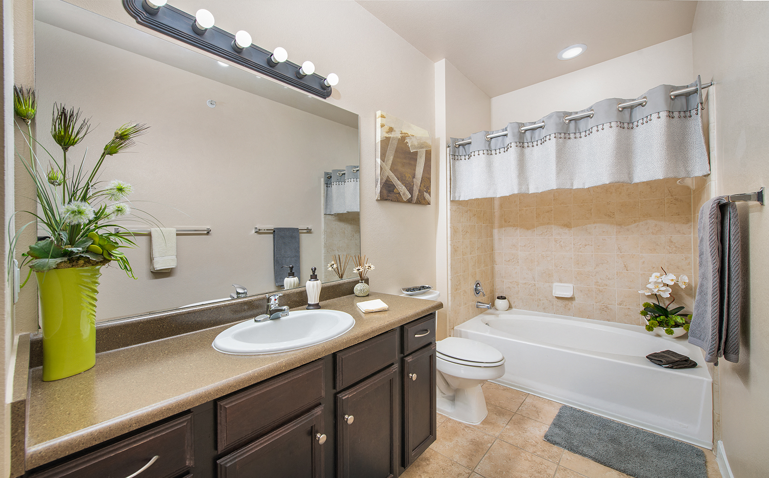 a bathroom with a sink and a toilet and a tub