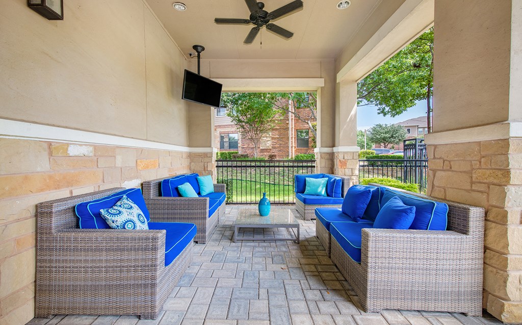 the preserve at ballantyne commons covered patio with couches and a tv