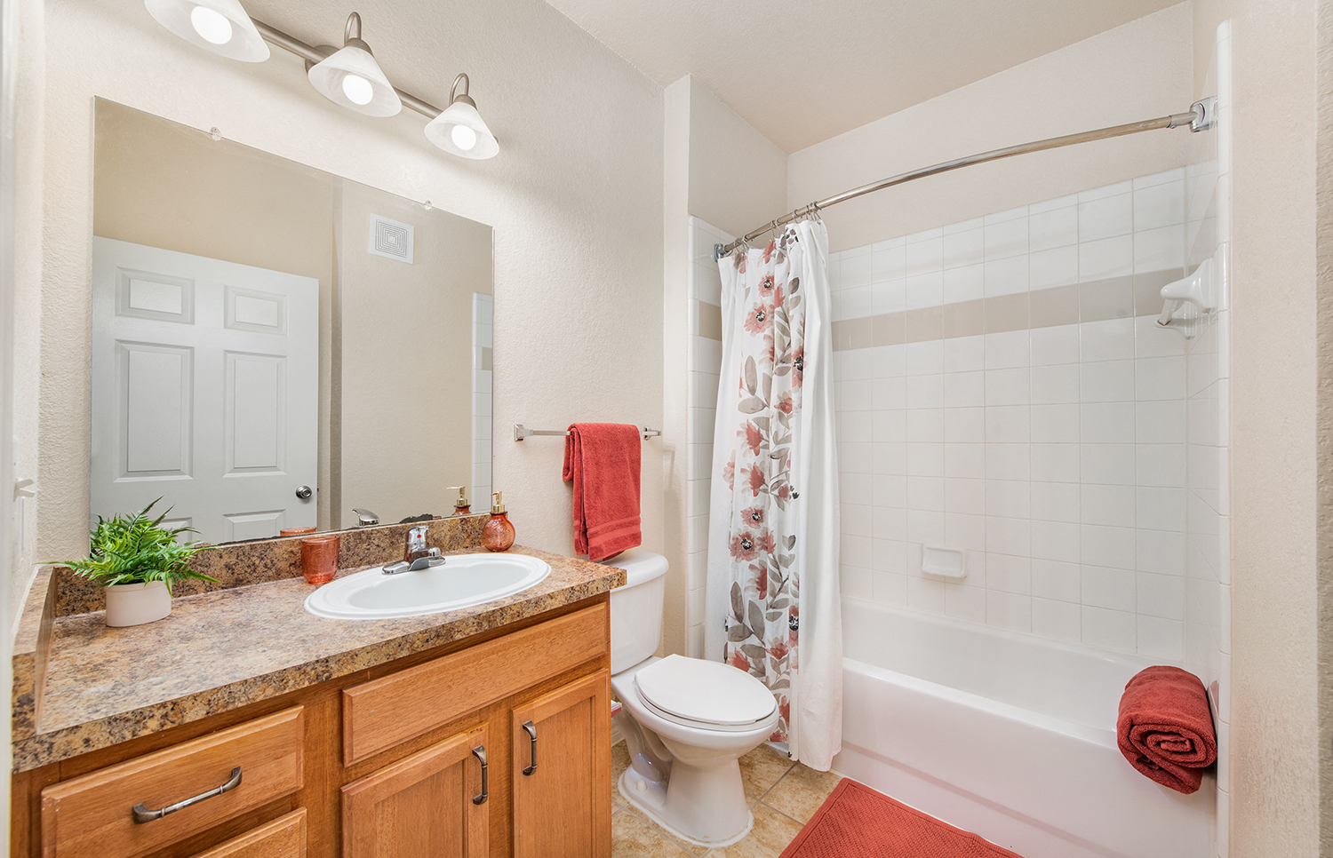 a bathroom with a shower toilet and sink