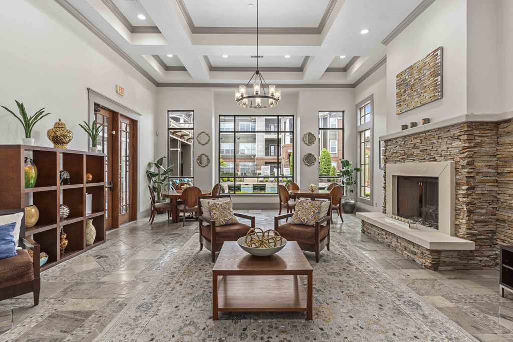 a living room with a fireplace and a table