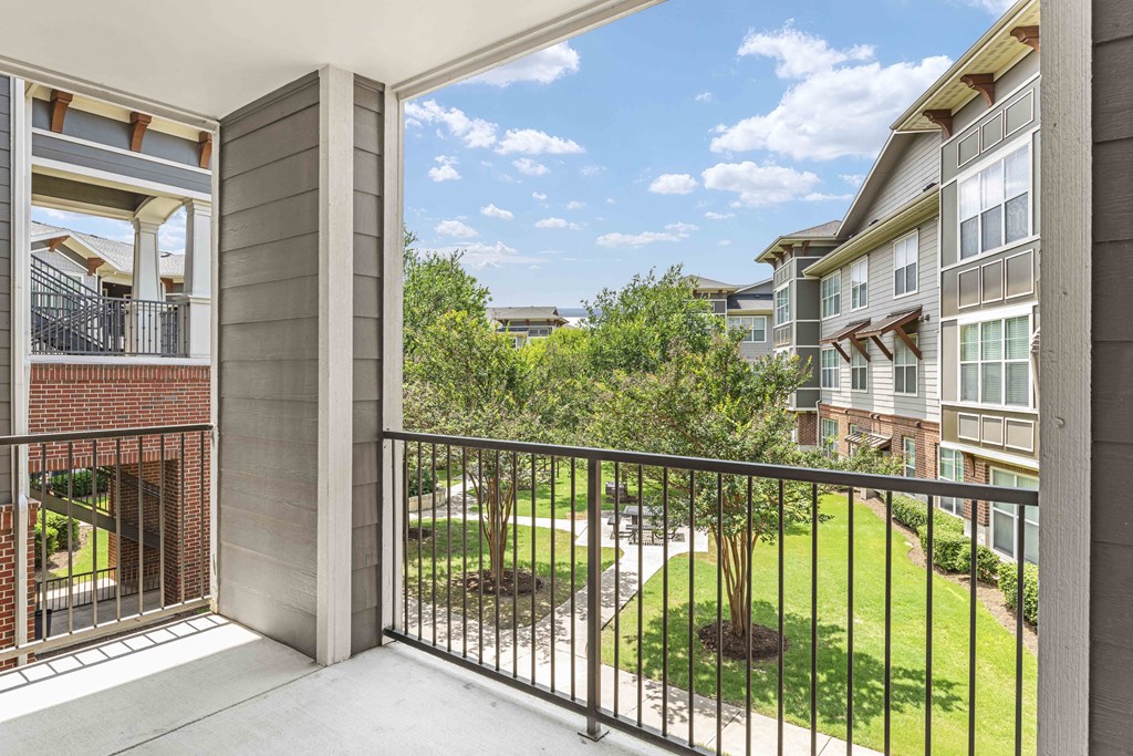 the view of the yard from the balcony of an apartment building