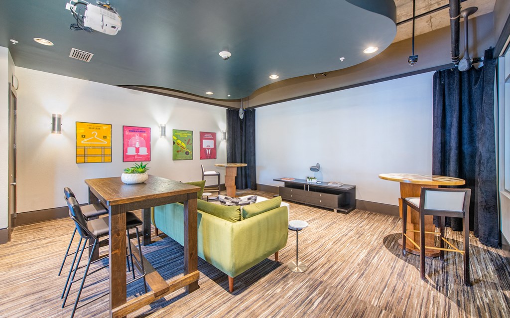 a living room with a table and chairs and a couch