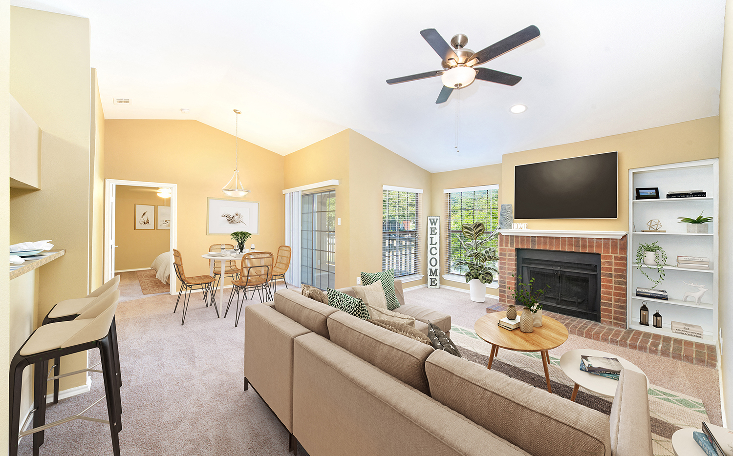 a living room with a couch and a fireplace