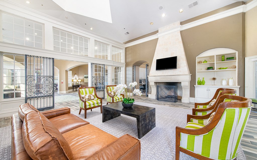 a large living room with a fireplace and furniture