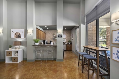 A modern kitchen with a dining area and a bar.