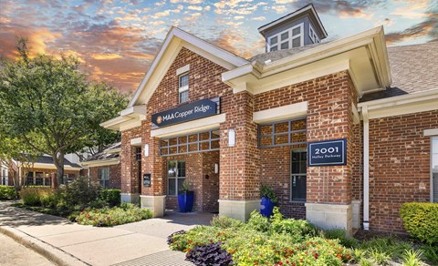 The image shows a building with a sign that reads "MAA Cooper Bridge" and "2001".