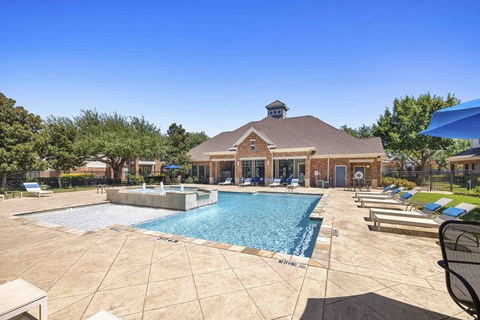 A large house with a pool in the backyard.