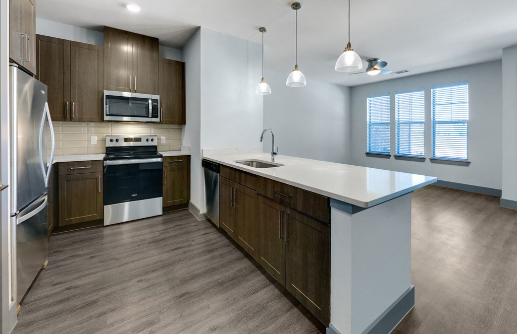 the preserve at ballantyne commons apartment kitchen with stainless steel appliances