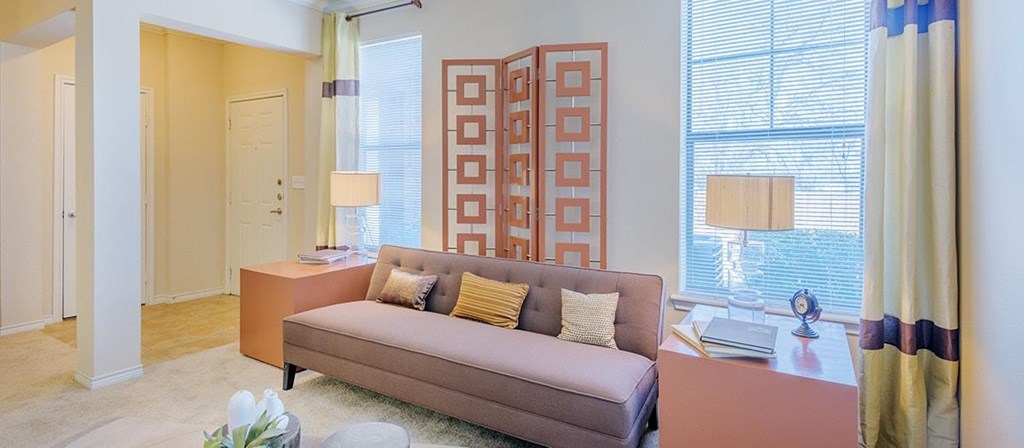 a living room with a couch and a table
