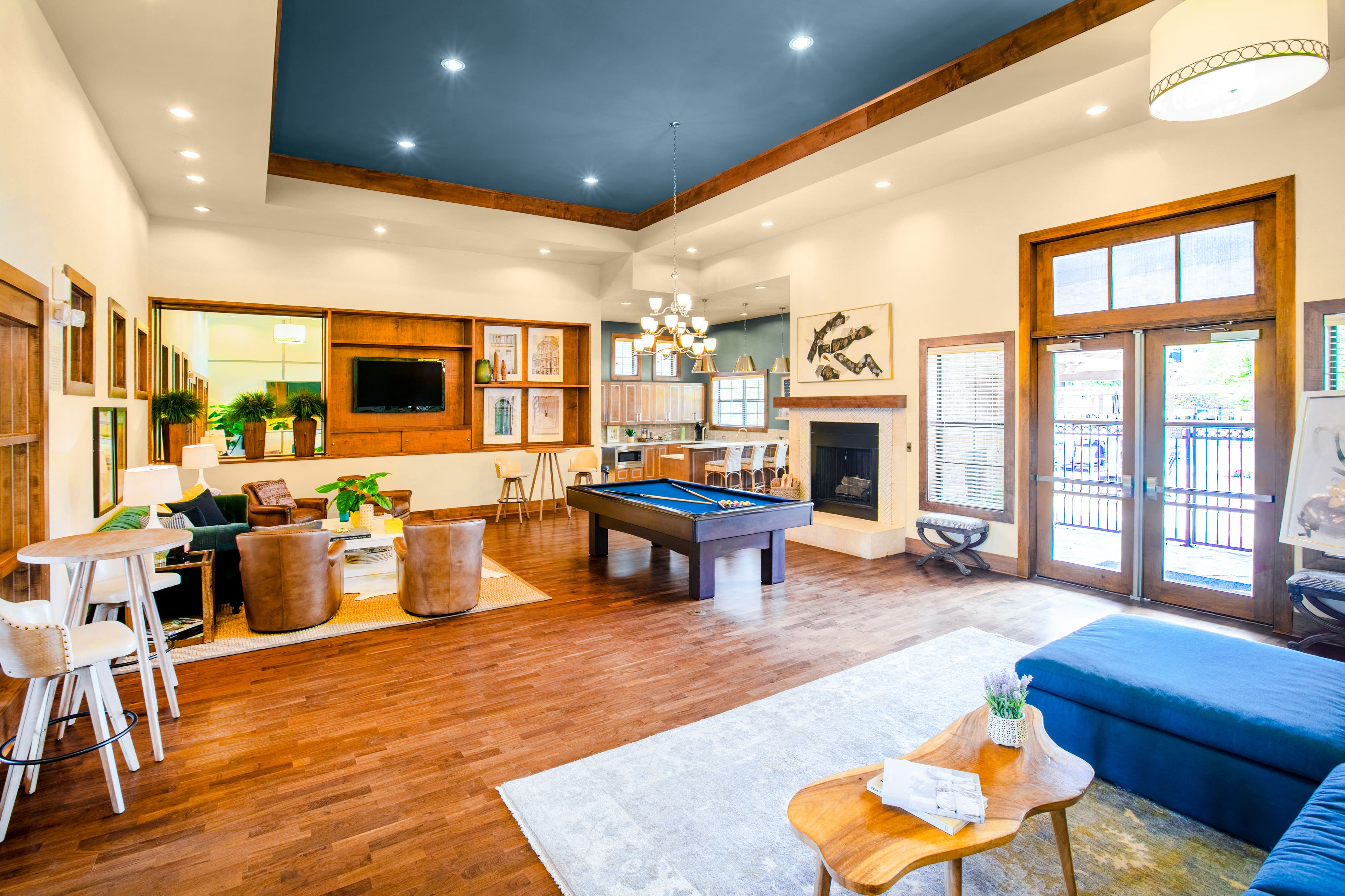 a living room with a pool table in the middle