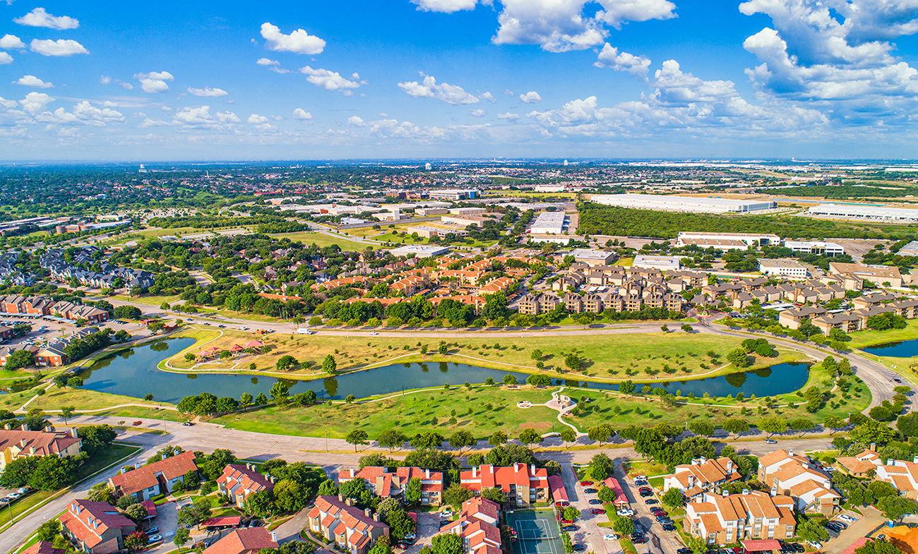 an aerial view of a city with a river