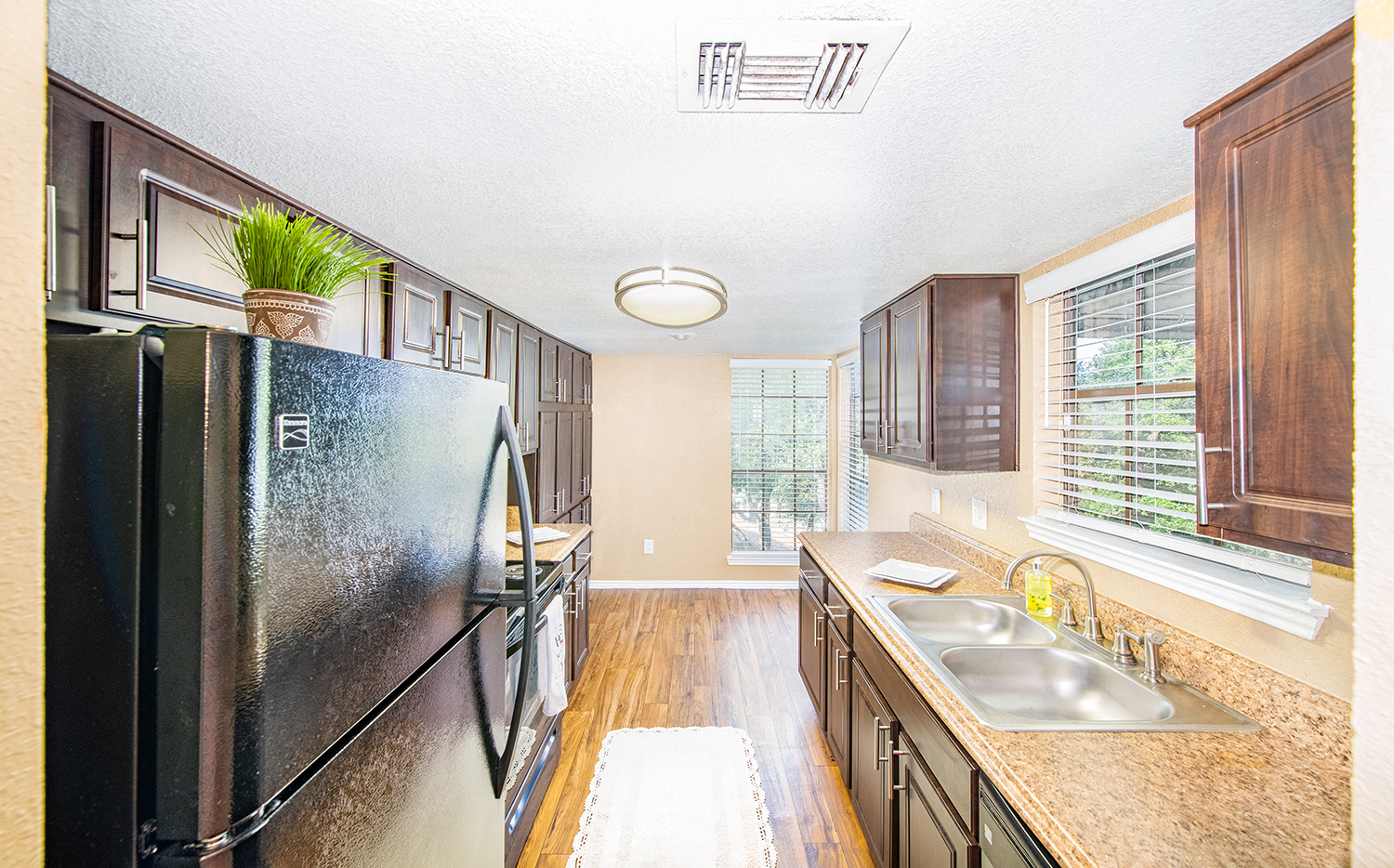 a kitchen with stainless steel appliances and a large window