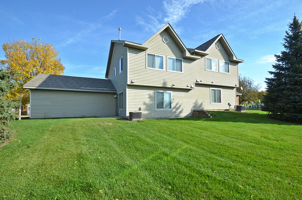 a large house with a yard in front of it