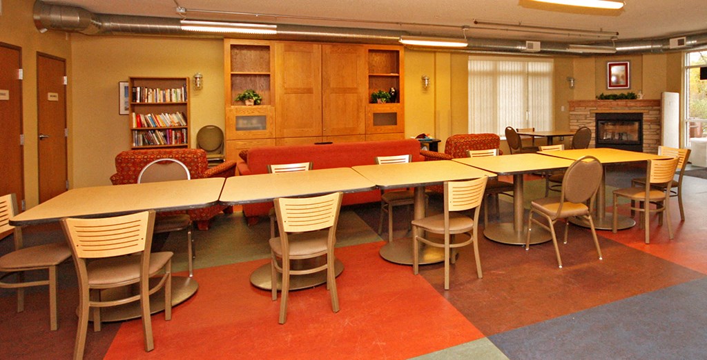 a large meeting room with a long table and chairs