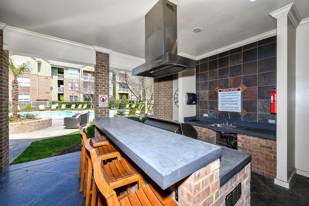 Outdoor Entertainment Space with Gas Grill and Bar Height Seating and Amble Counterspace at Alden Place at South Square Apartments, Durham, NC