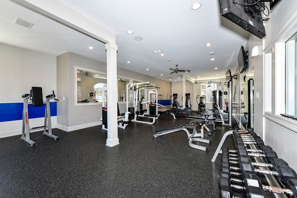 State of the Art Fitness Center featuring Wellbeats™ with Cardio and Weight Training and Flat Screen TVs at Alden Place at South Square Apartments, Durham