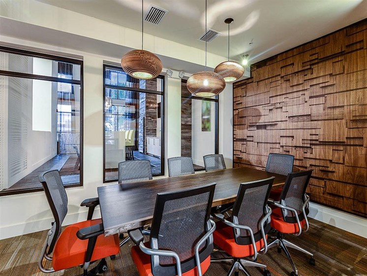 Expertly Designed Conference Room for Resident Use with Table & Chair Seating up to 8 at EOS Apartments, Orlando, FL 32826
