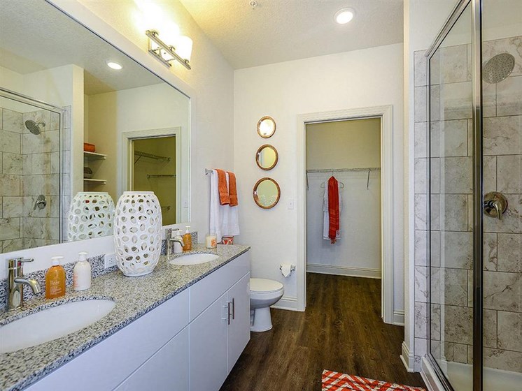 Relax after a long day in your bathroom with garden tub, granite countertops and walk-in showers at EOS Apartments, Orlando, FL 32826