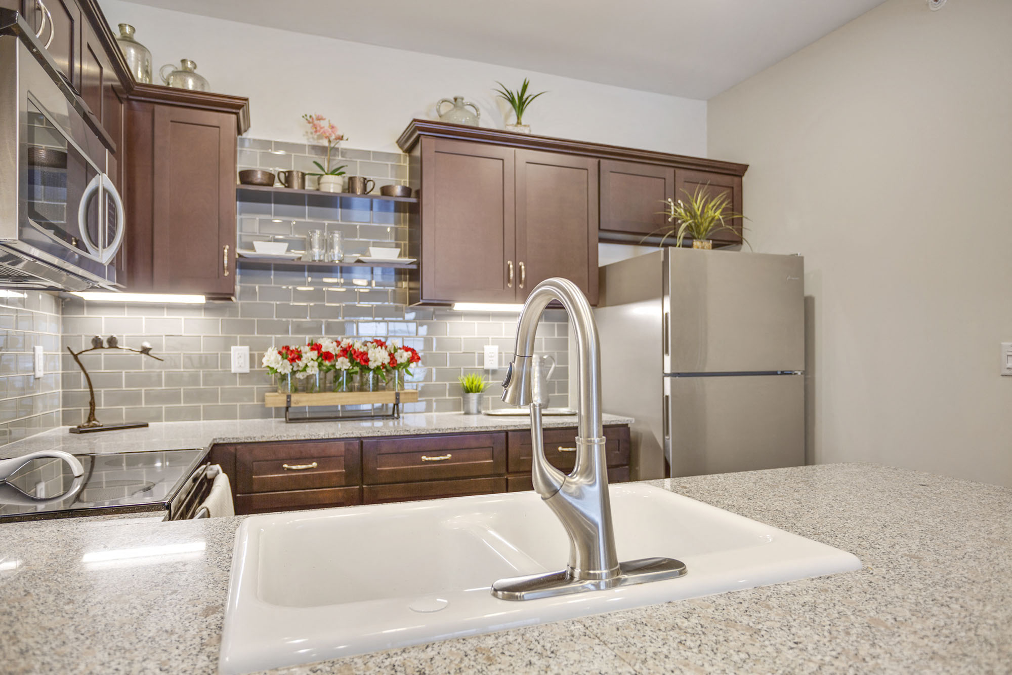 a kitchen with a sink and a refrigerator
