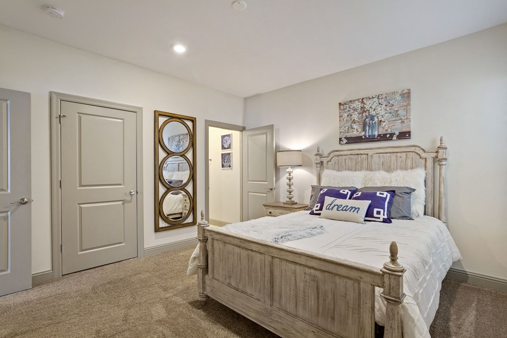 a bedroom with a bed and a closet