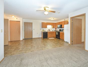Open Concept Kitchen, Dining and Living Room with Ceiling Fan