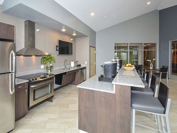 Clubhouse Kitchen with Large Kitchen Island and Bar Stool Seating