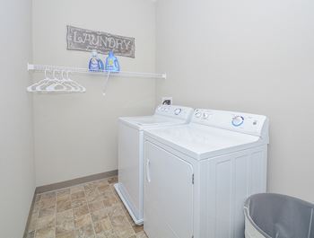 Large Closet with Washer and Dryer and Built-In Shelving