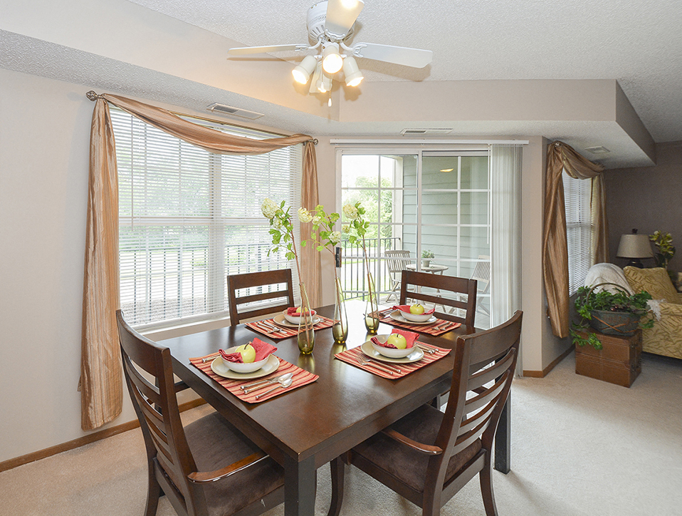 Ceiling Fan and Light in Dining Room with Large Windows