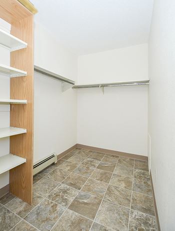 Spacious Walk-In Closets with Built-In Shelving
