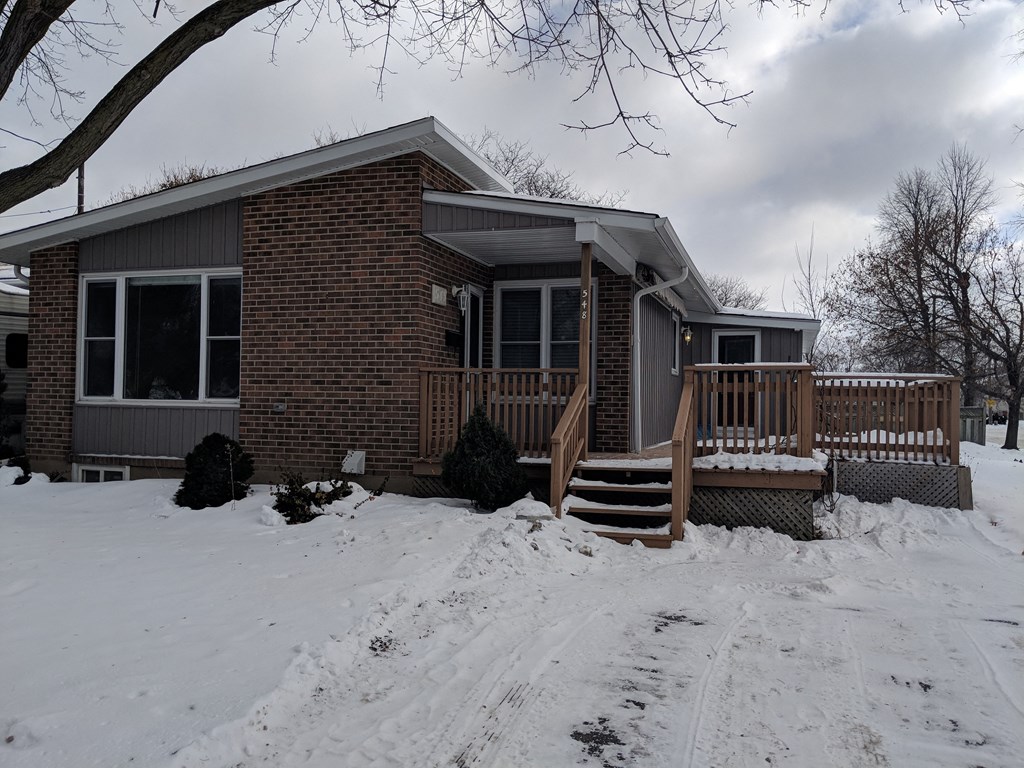 a house in the snow with a porch