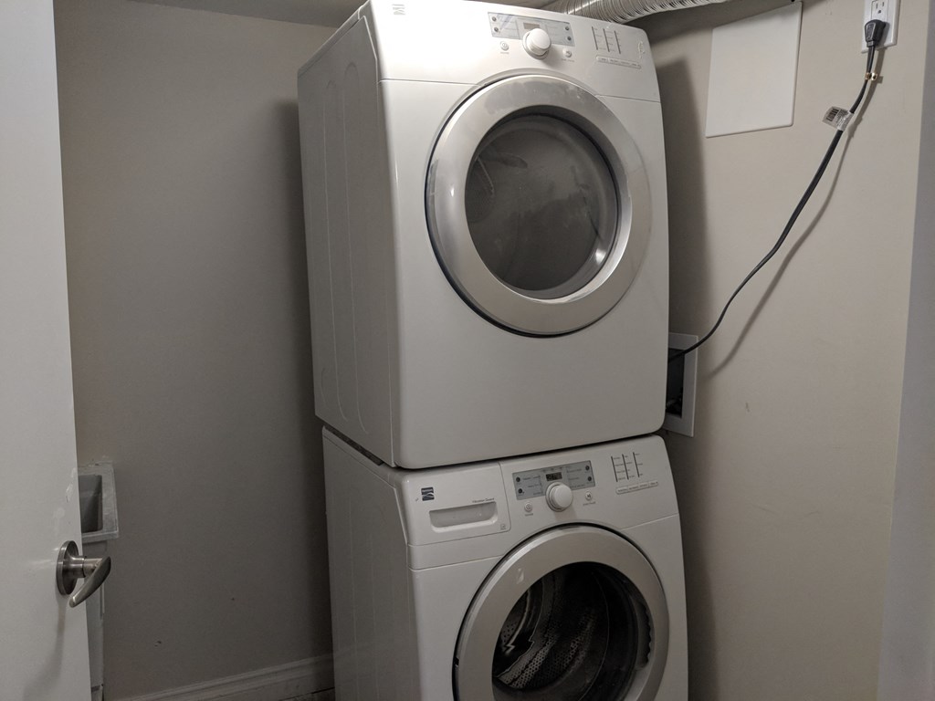 a washing machine and dryer in a laundry room