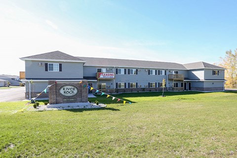 a large white building with a sign in front of it