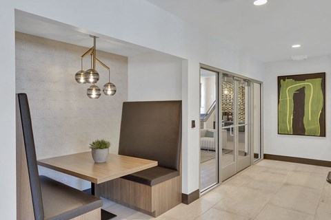 a dining room with a wooden table and a chair