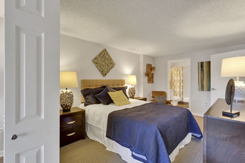a bedroom with a bed and a dresser