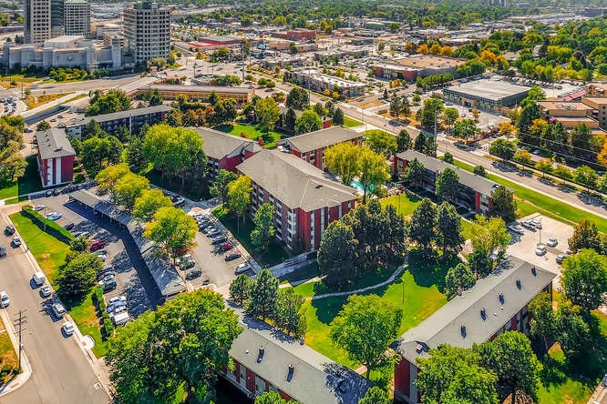 an aerial view of a city with buildings and trees