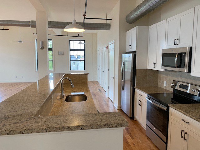 a kitchen with a granite counter top and a sink
